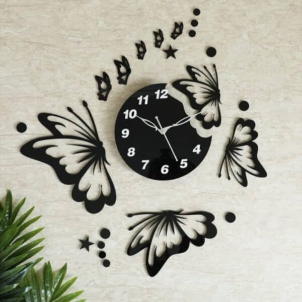 a clock with butterflies on the wall