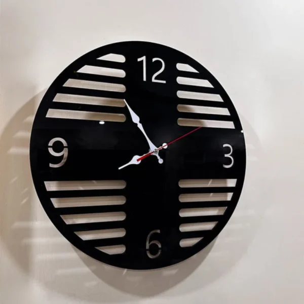 a black color clock on the wall. Acrylic Wall Clock