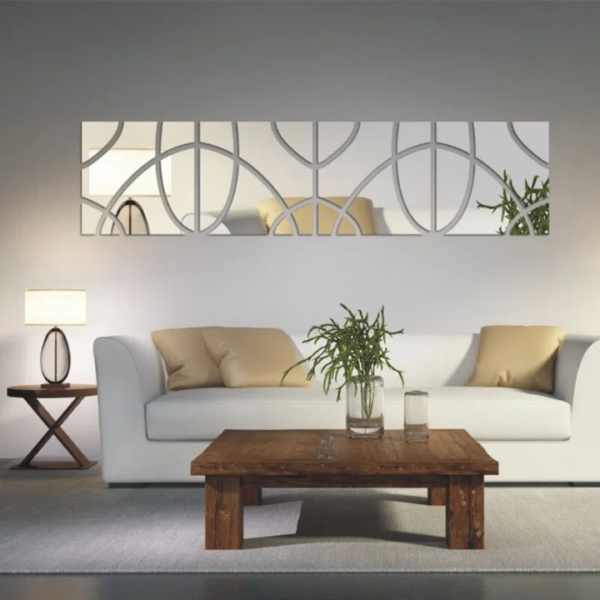 a white couch, wall mirror and a coffee table in a room. Geometric Art 3D Acrylic Mirror