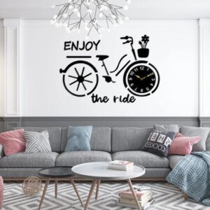 a cycle style clock on the wall and text written on the wall for wall decoration. Premium Cycle Wall Clock