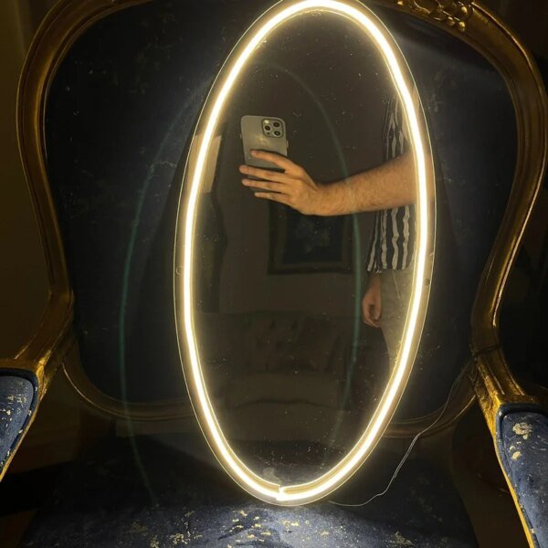 neon selfie mirror on the wall