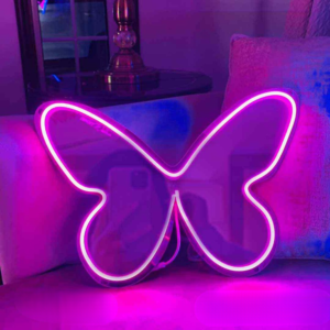 a butterfly selfie neon mirror on the wall.