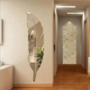 a mirror on a wall. Silver Acrylic Leaf Mirror