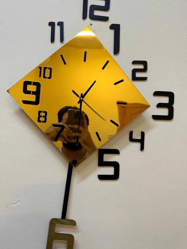 a golden color clock on the wall